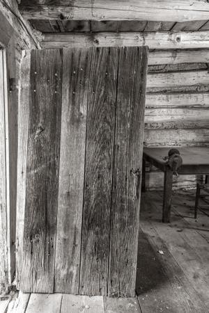 Board-and-batten door made with circular-sawn boards fixed with 